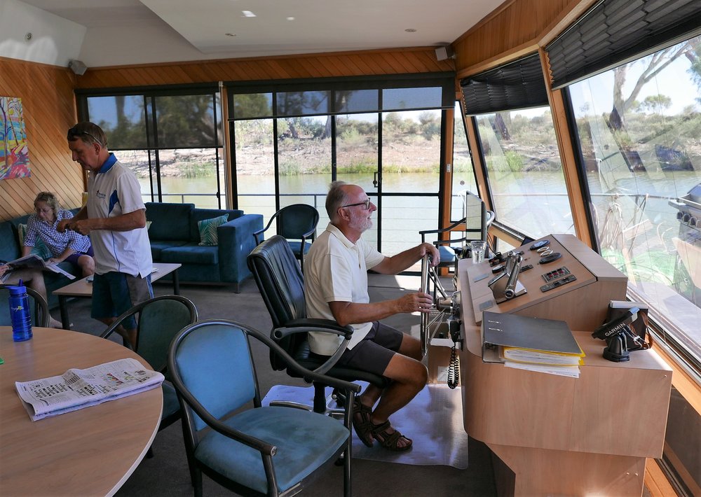   Captain Ken on the bridge of the boat  