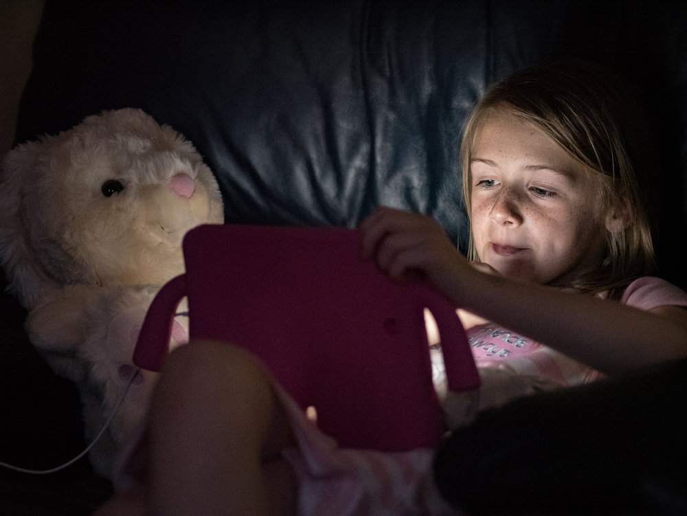 The iPad generation, taken with Panasonic GX8 and 75mm Olympus f/1.8 at ISO6400 (image Mike Evans)