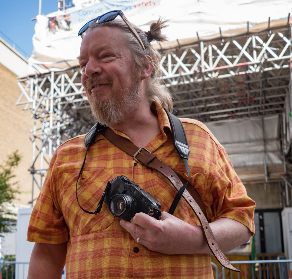 Simon just happened by as I was talking with Nico — and I spotted his black Contax G2. Just another film camera in Brick Lane. Below: a well-cropped profile shot of the enticing Contax.