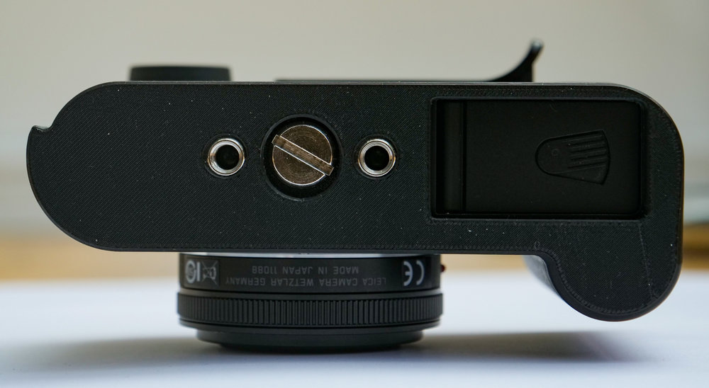 The two tripod threads are convenient for many photographers but cause the base to be over thick
