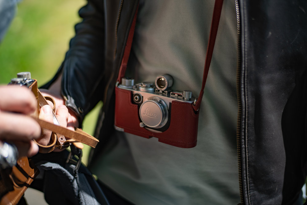 Interesting cameras a-dangling all over the place. This pristine early Leica, I think a Model I, was being touted for sale but when we asked the price the answer was a coy