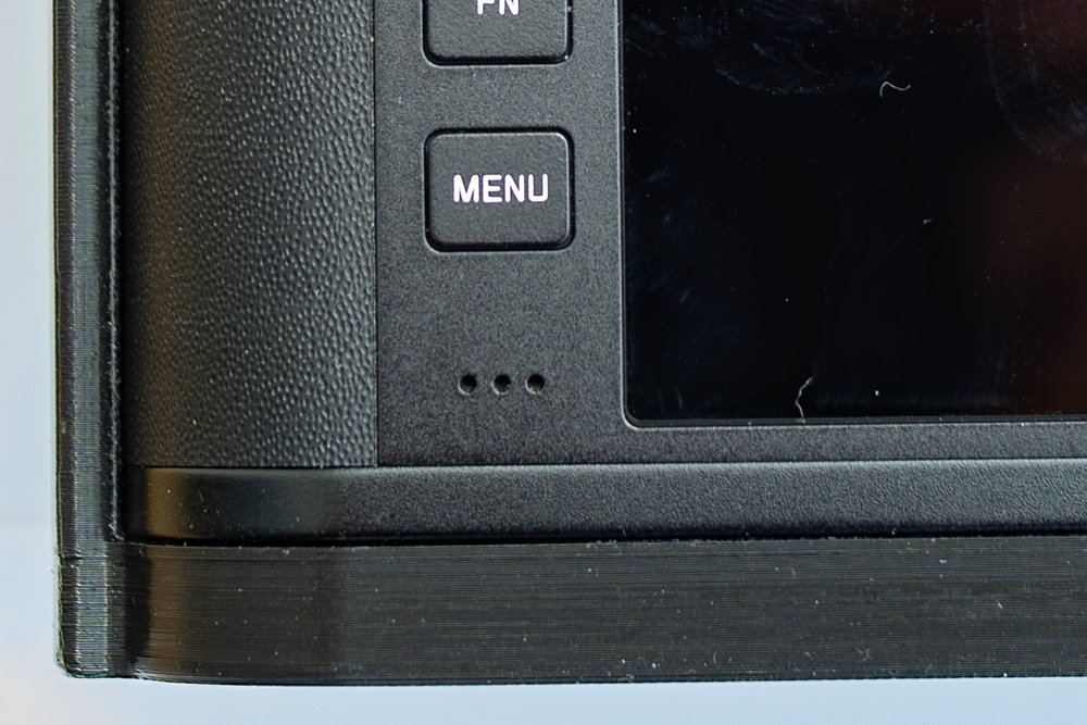 The two main drawbacks with the case. Above, the base is 8.2mm thick to accommodate the tripod threads. Below: The case cannot be mounted or removed without first unclipping the strap split ring from the lug