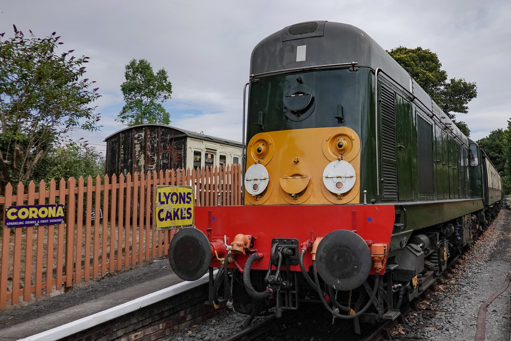 No steam today — the fields were tinder dry and the volunteers of the C&PRR rightly smelled a whiff of burning lawsuit if they dared fire up the steam engine. We had to make do with this diesel loco which bore an uncanny resemblance to Thomas the Tank Engine.