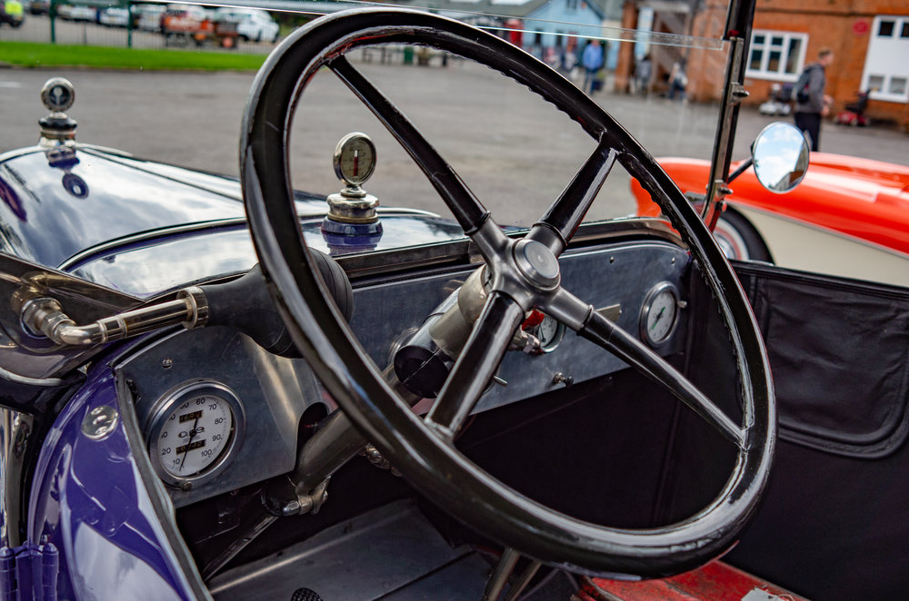 Them were the days — no power assistance for this massive helm, no synchromesh for the crash, crash, crash three-speeder. Scant protection for le chauffeur, come to that