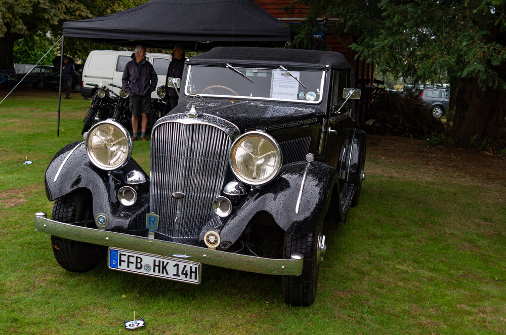 I know about this car because there was a helpful notice in the windscreen. It had arrived at Middle Aston all the way from Fúrstenfeldbruck county in Bavaria, to the west of Munich. It is owned by Heinrich Klimaszewski-Blettner and is a Brough Superior Hudson 3500cc six-cylinder originally registered in Cornwall on November 16, 1938. I hope he didn