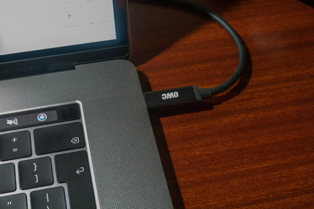 The one cable which connects the multi-function dock to the computer. The only snag is that strictly speaking, connected drives must be ejected manually before pulling the plug. A simple toolbar utility, Semulov, makes the process quick and easy. Incidentally, note the finger-sensitive touch button to the right of the Touch Bar. It makes the operation of the computer so much easier and avoids the need for frequent typing of passwords