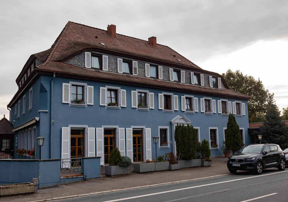 Above: Jim Clark spent his last night here in the Luxhotel at Altlussheim. He had been interviewed by a local television station on the Saturday evening and returned to the hotel at 2 am. According to members of the team, he was rather subdued at a breakfast and told them not to expect too much of him that day. Below: The garages beneath the hotel where the Lotus team worked on the cars before the race