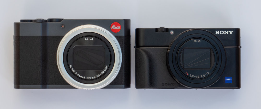   The difference in size between these two cameras is pronounced. The Sony is the true pocket camera while the C-Lux packs in more controls and near-twice-the-reach zoom lens. The difference in height is largely explained by making room for the viewfinder. On the Leica it is ready for action while the Sony relies on a pop-up affair, thus enabling a lower profile. However, the Sony is much more expensive. You pays your money and you takes your choice  