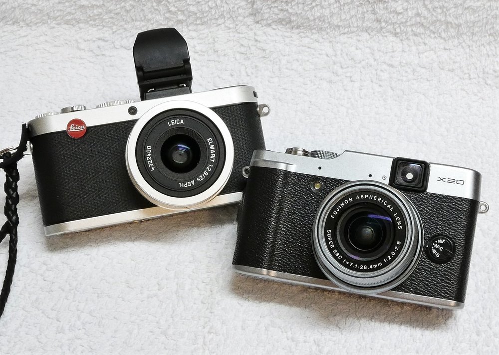   Leica X2 and Fuji X20. Both cameras from circa 2012. If only the X2 had that wonderful retro optical viewfinder from the X20, or an EVF in the space taken up by the inbuilt folding flash unit. Instead, the X2 has an optional electronic viewfinder. It is a “lump” that I never ever use – it throws the camera right out of visual balance. Whatever were they thinking?  