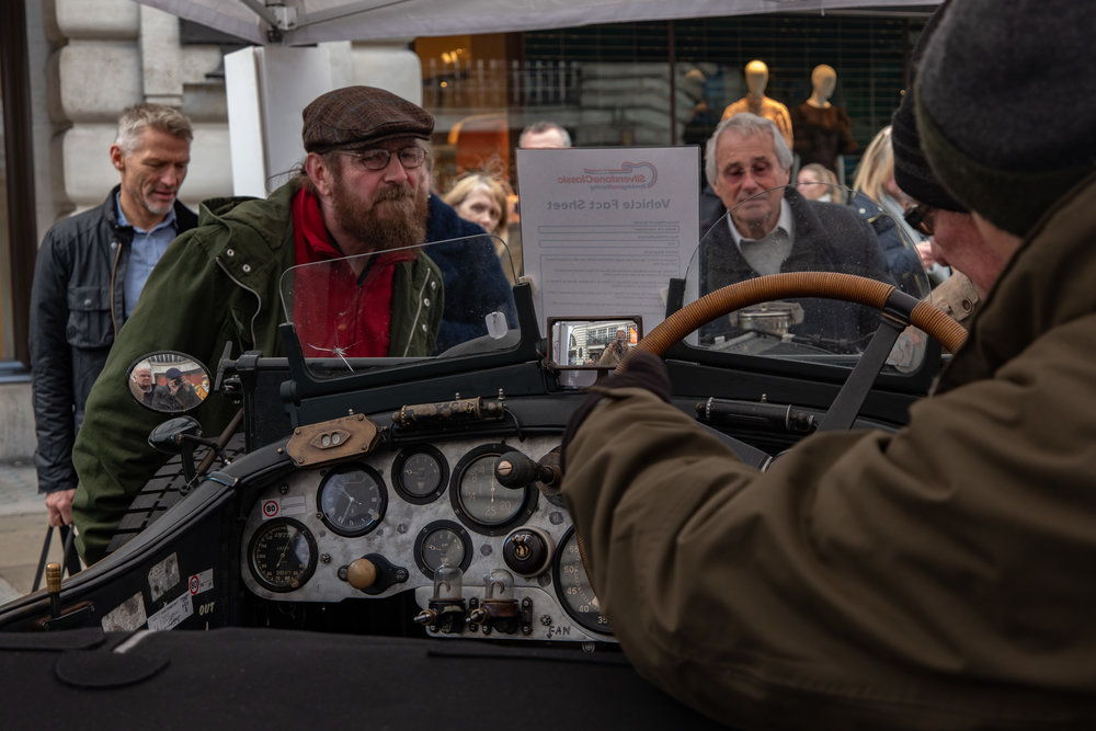 Back to Regent Street and a close inspection of a classic Bentley. Below, the snapper snapped in the Bentley’s rear-view mirror. A crop too far, but interesting nonetheless as a demonstration of the detail captured by this lens