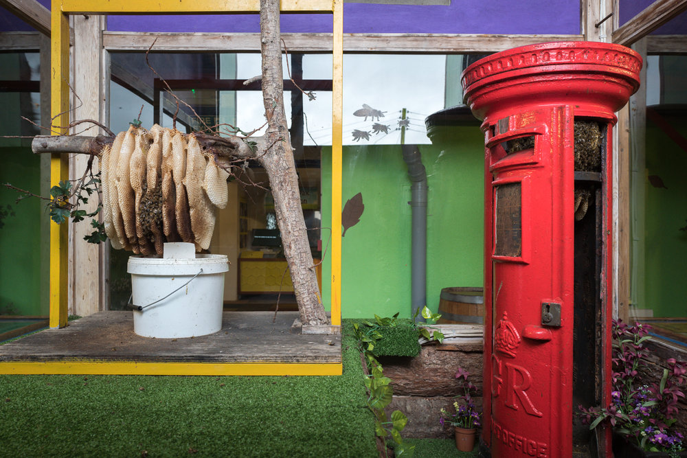   The red pillar box with bees inside shows what happens when you place a known circular object in a margin of the frame when using any wide-angle lens. (Leica Q ISO 1,000 1/60s f/5.6)  