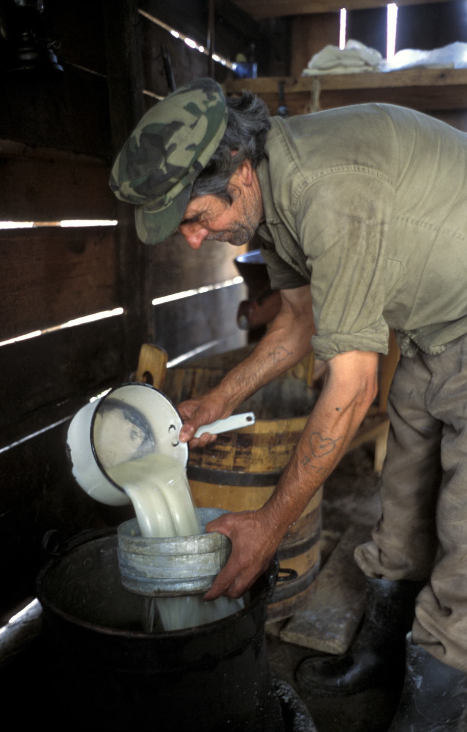 Shepherd making sheep cheese near Szekelyderz (Leica M6 and 50mm f/2 Summicron)
