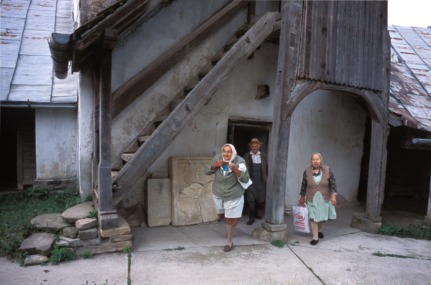 People entering the fortified saxon church in Szekelyderz dariju village in Transylvania (Leica M6 and 35mm f/1.4 Summicron)