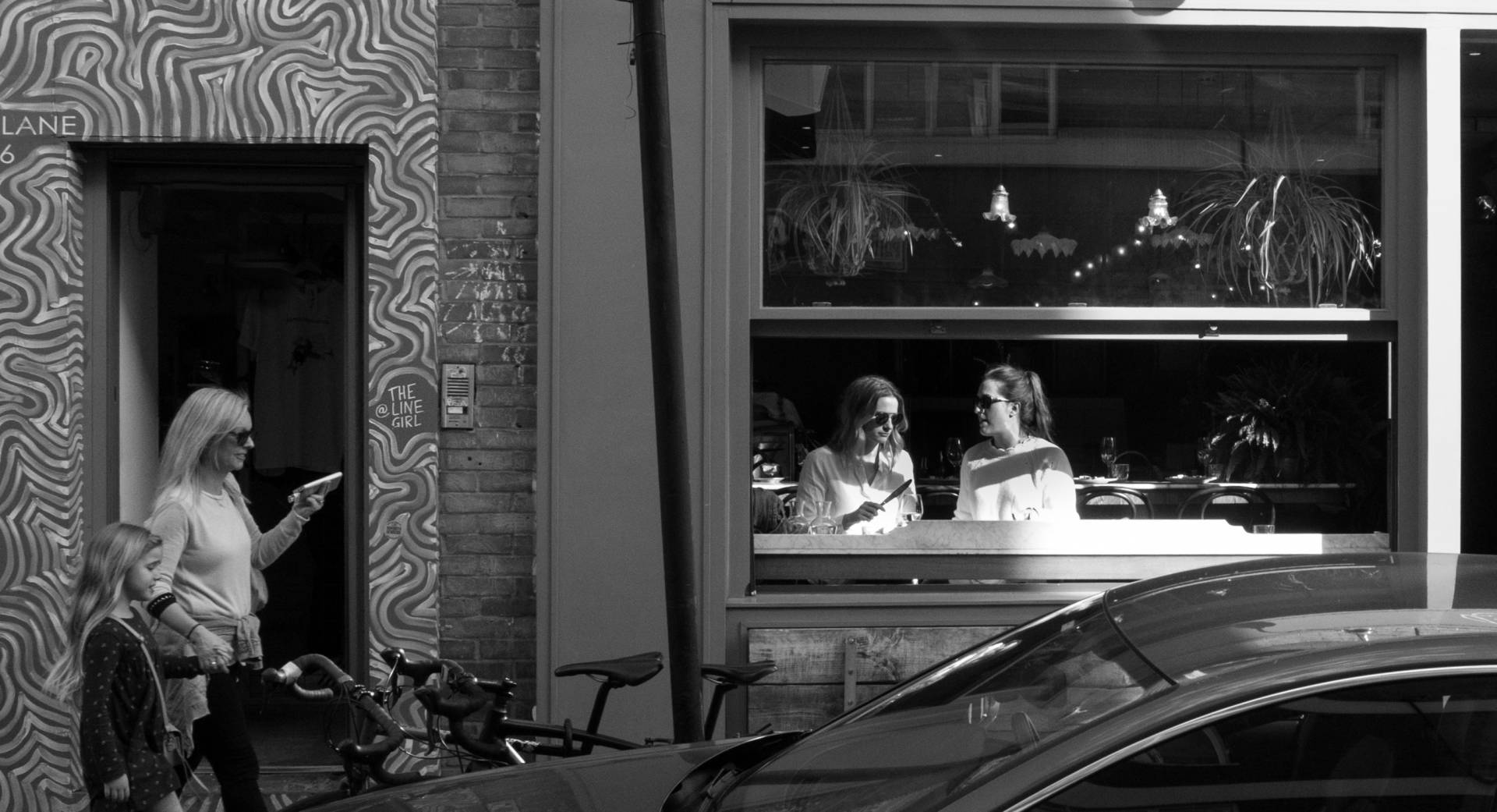 Line of girls, with art by The Line Girl. Leica X1
