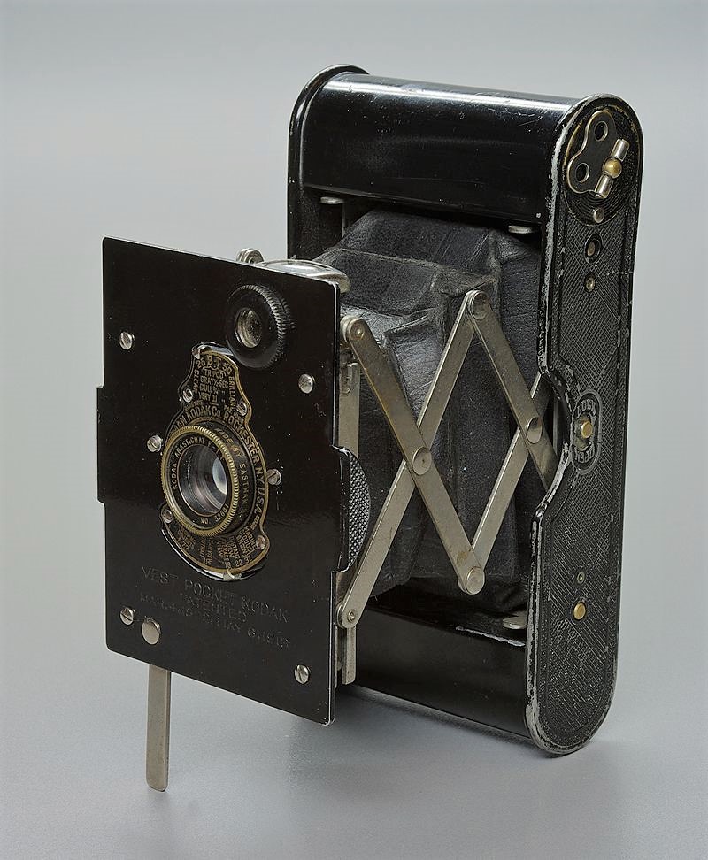 An example of an early Kodak Vest Pocket camera. Compact kit in its day, using 127 film (Image Wikipedia Commons).