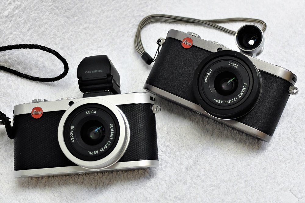 Leica X2, left, with the Olympus EVF (cheaper than Leica but exactly the same) and the X1 with optical viewfinder (Image Wayne Gerlach)