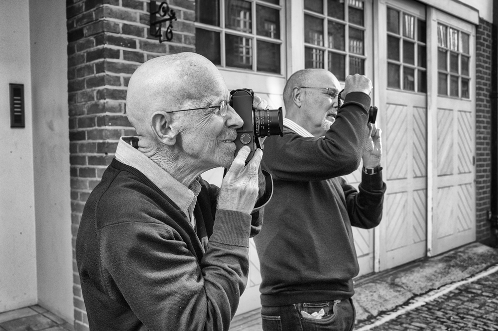 2013 and editor Mike (right) tries out the Leica Monochrom with his old friend George James outside Leica Mayfair