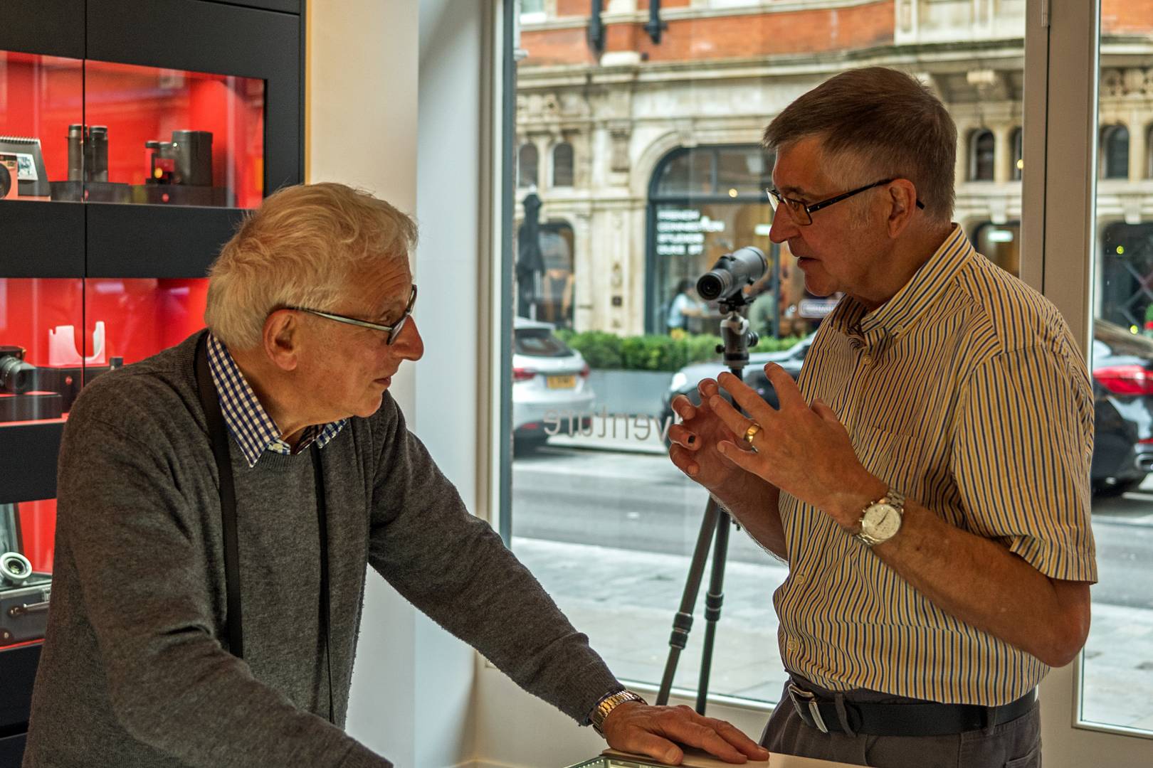 John Dudkins LRPS, wearing his Leica watch, charring with Chris Angeloglou, the former Sunday Times picture editor