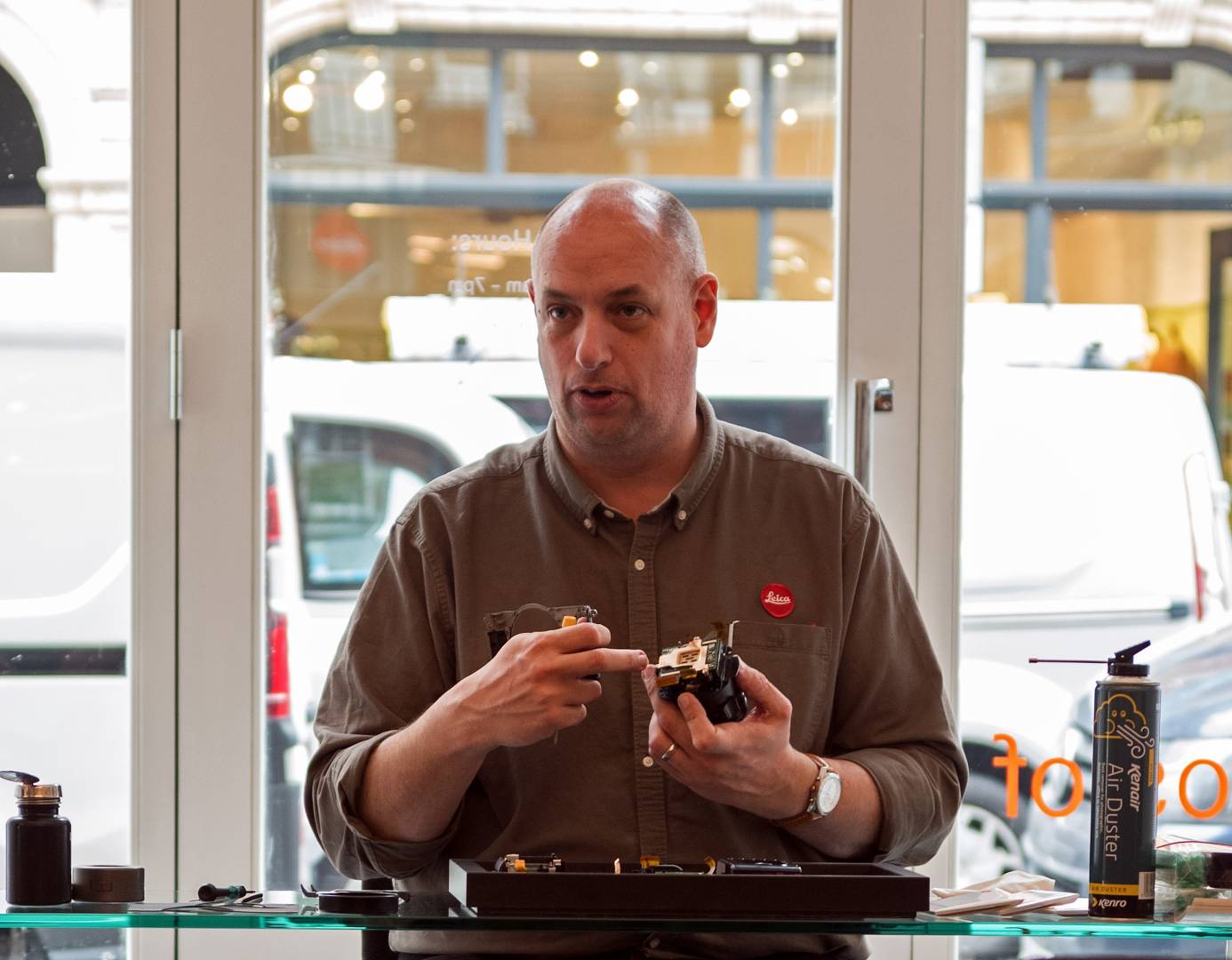 Leica technician David Slater dismantling the Leica Q