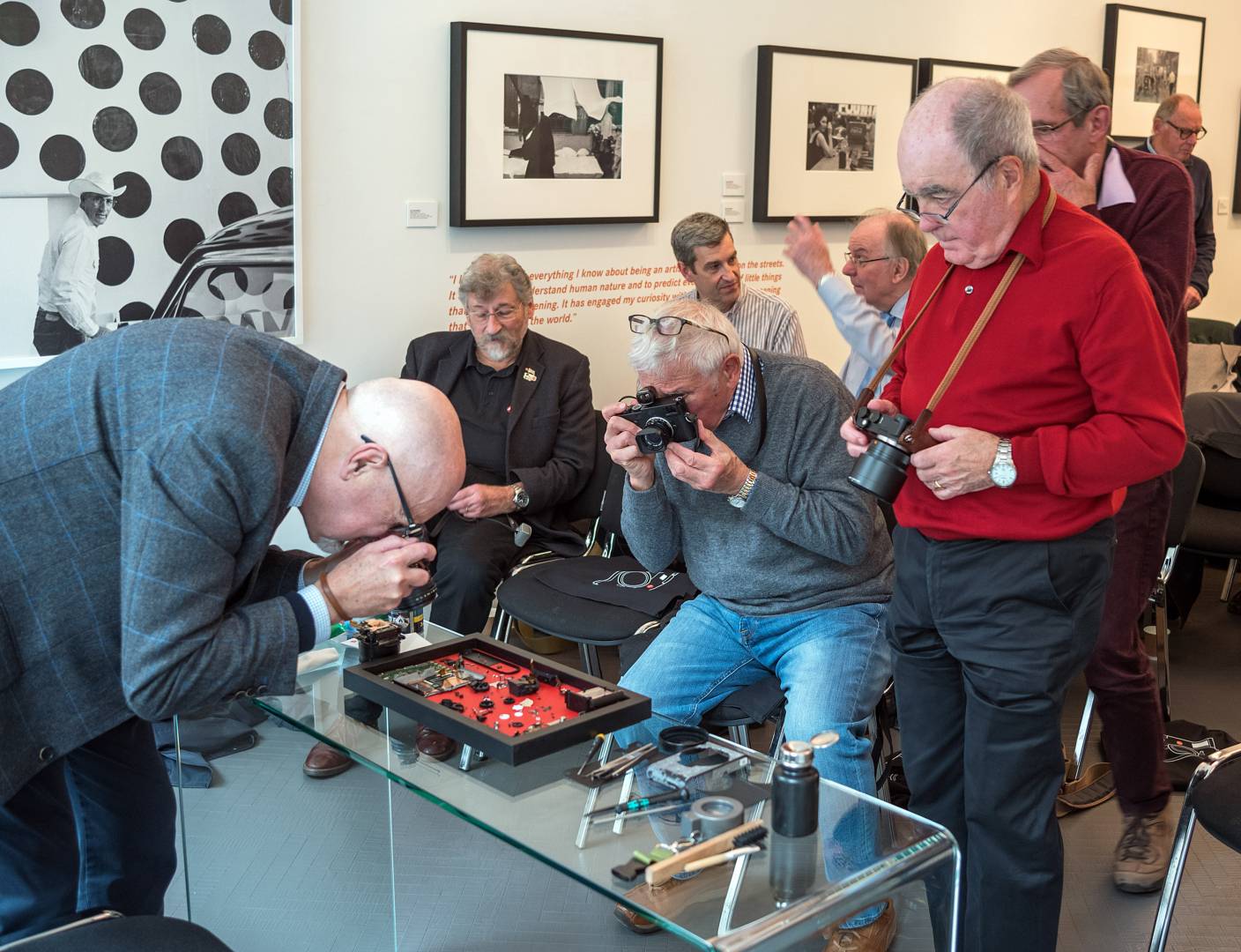 Editor Evans at work, left, with Chris Angeloglou, Lionel Square, Nobby Clark, Ohil Coomes, Peter Anderson and Paul Hensel