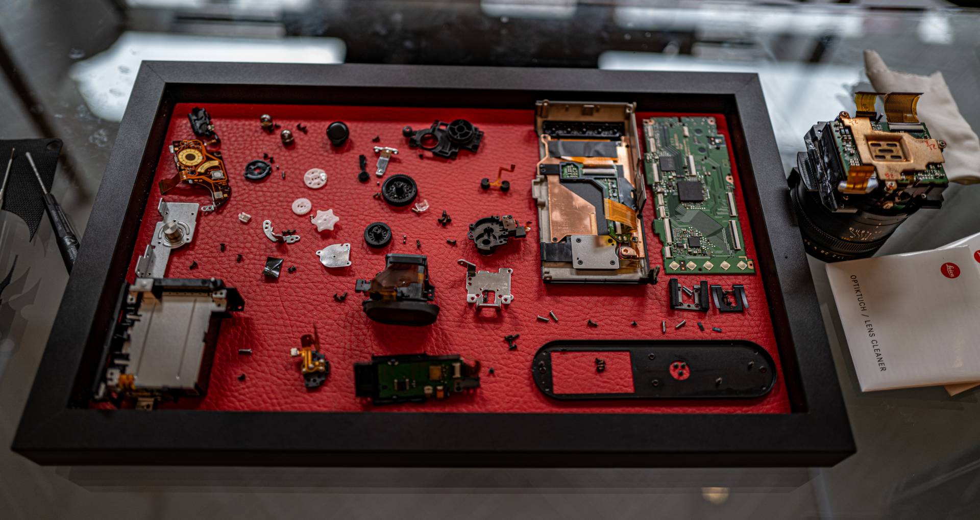 The components are laid out in a pre-determined order which is an aid for re-assembly, particularly when dealing with a new camera.