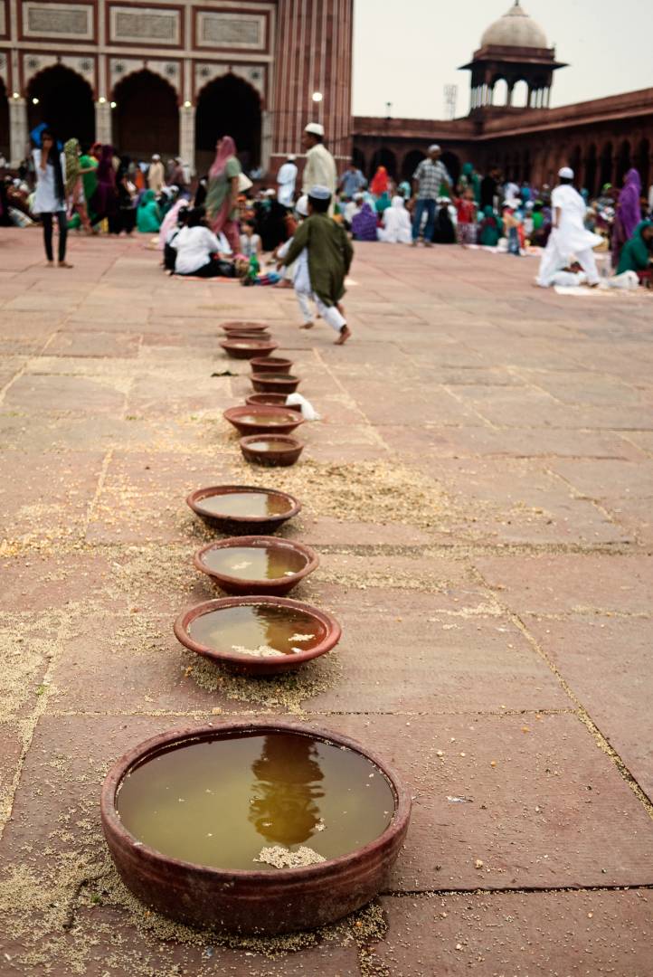 Ramzan at the Jama Masjid. As I framed my shot I was lucky to get the lad running in the background.