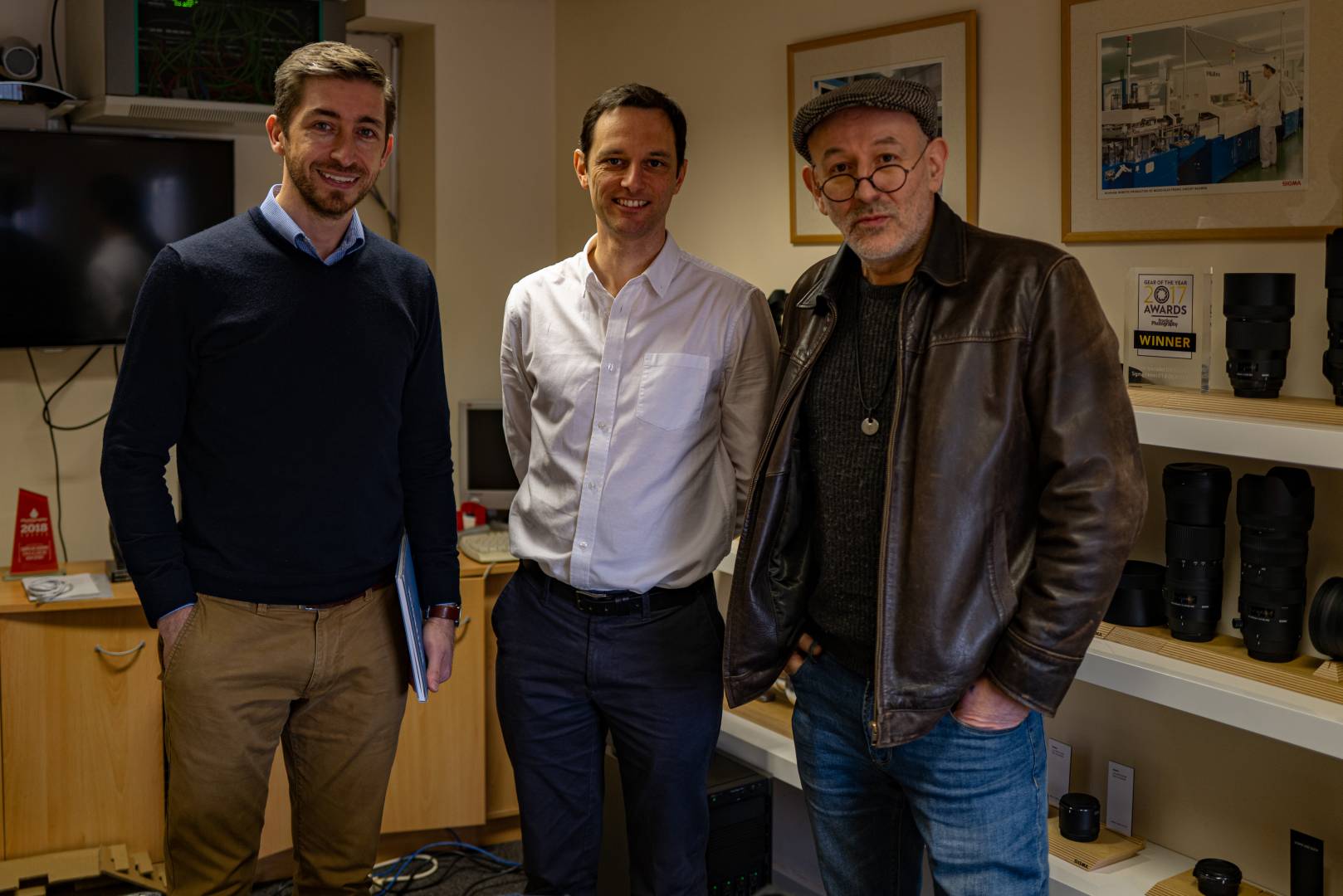 Tim Perry, Sigma's media and marketing manager with general manager Paul Reynolds, centre, and photographer Mara Kolodzinski