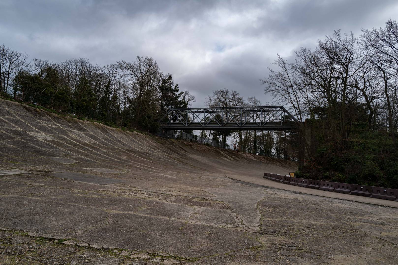 Deserted. The 1907 banked racing circuit, one of the wonders of the age, with the Members' Bridge crossing to nowhere. 18 March 2020, Leica Q2
