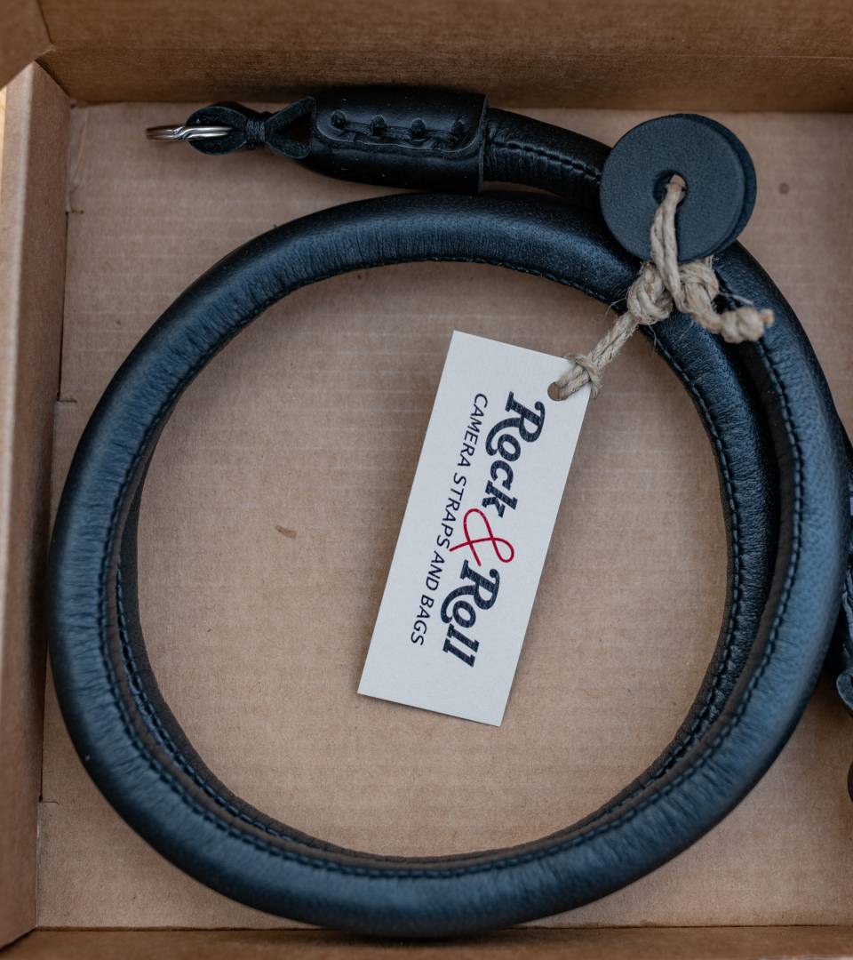 The Black Lash strap as it is unpacked. Note the two leather rings which can be push onto the camera strap lugs to provide added protection for the camera.