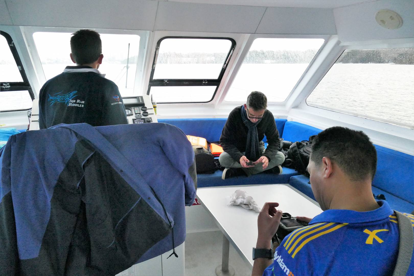 Inside the captain steered us back while photographers began downloading and editing