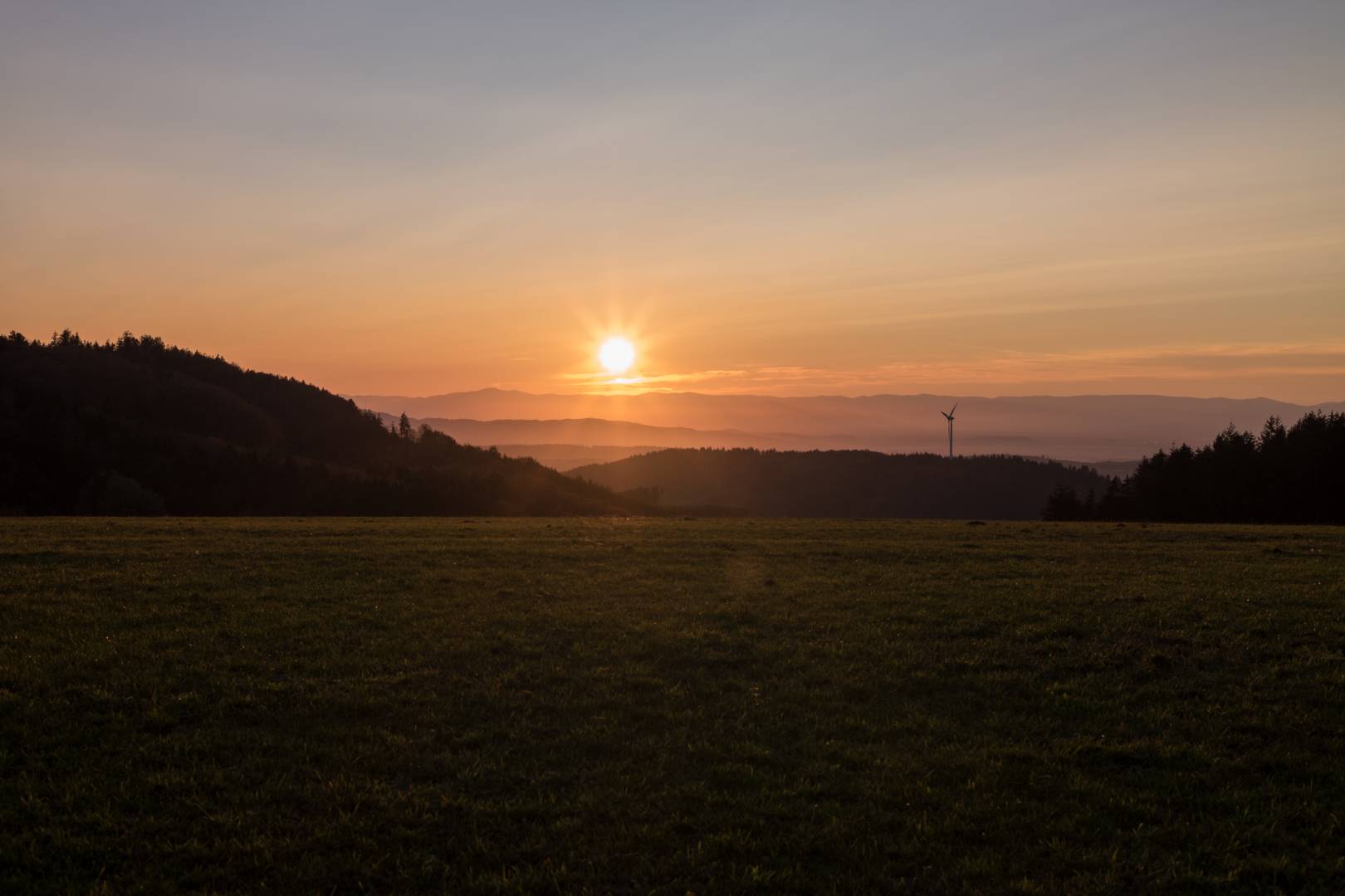 Sunset over the Vosges Mountains in France, seen from the first hills of the Black Forest on the other side of the Rhine in southern Baden. Konica M-Hexanon on Leica M10. Note the flare resistance of the lens (shadows moderately enhanced to show the optical performance of the lens).