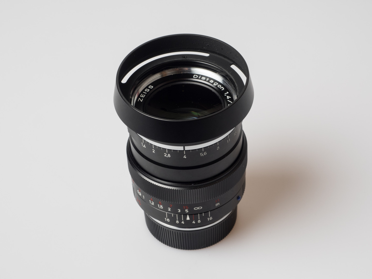 Zeiss offers a designated lens hood (#000000-2112-813), but I found the slightly less expensive Voigtländer LH-13 suspiciously similar. And, surprise, it perfectly fits the bayonet mount, and it causes no vignetting.
