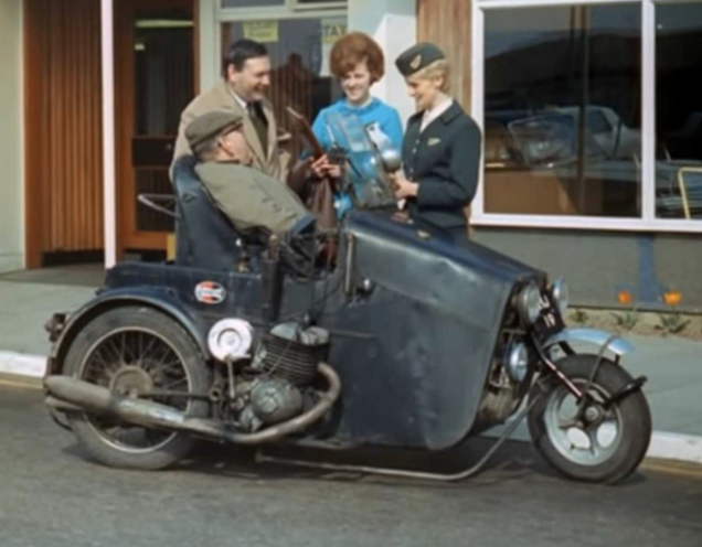Derry Preston-Cobb in an early 1950s versio of the Invacar. It looks like he's receiving some sort of award from an "air hostess" as they used to call them. I wouldn't mind betting this is at Southend Airport, near to the Greeves factory in Thundersley