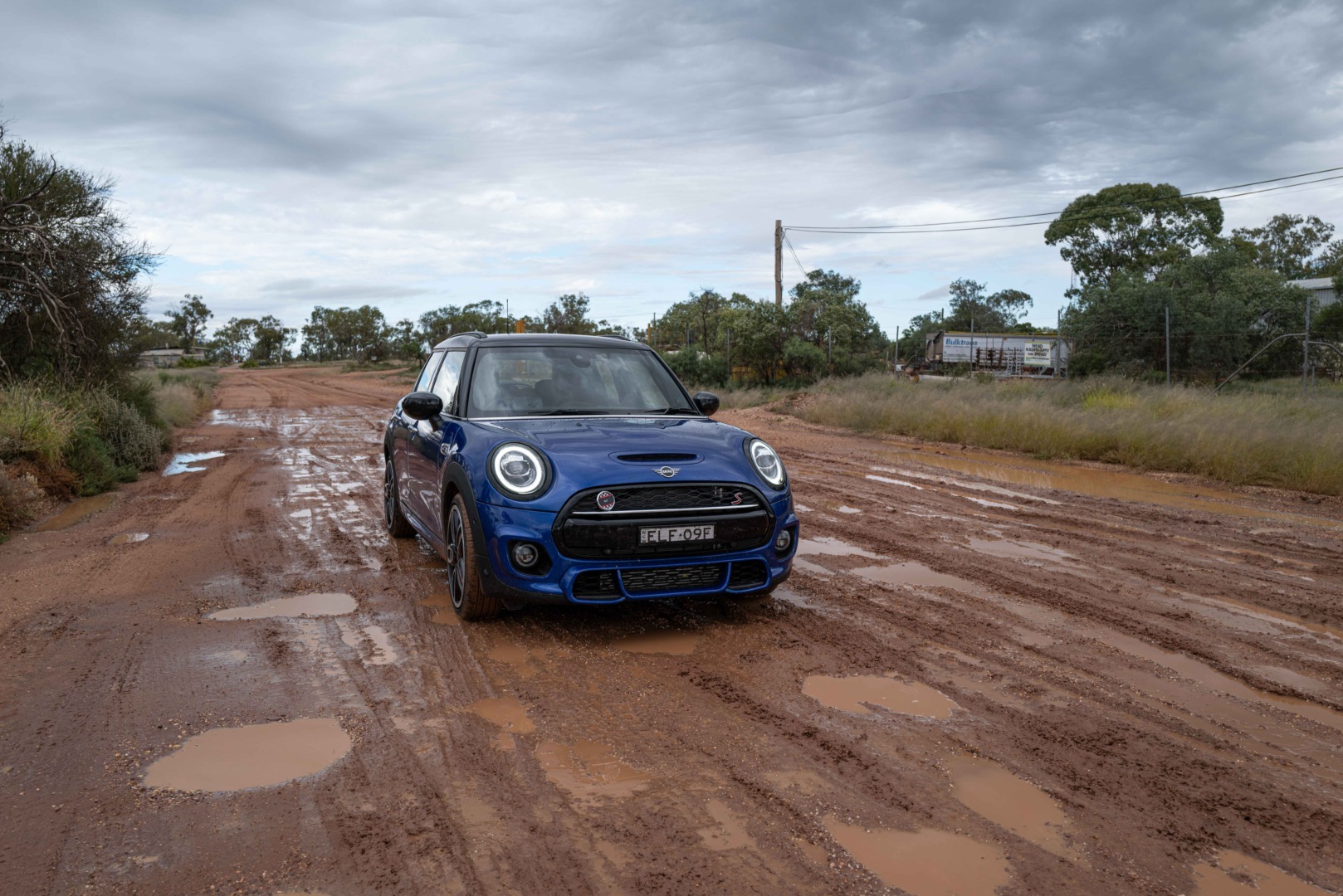 Mini on wet road
