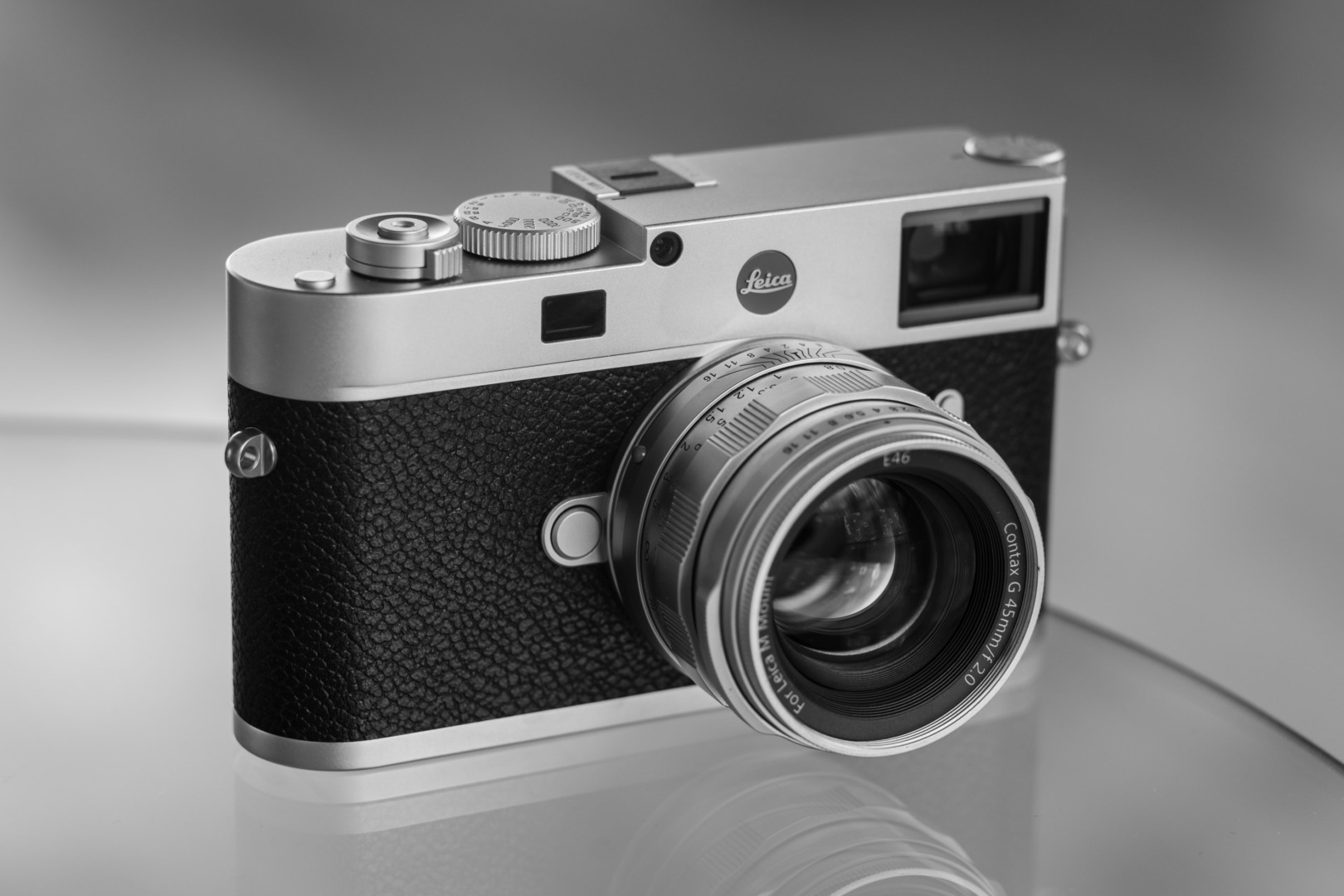 The Leica M11 in chrome with a vintage lens, the Contax G45 in a Funleader body