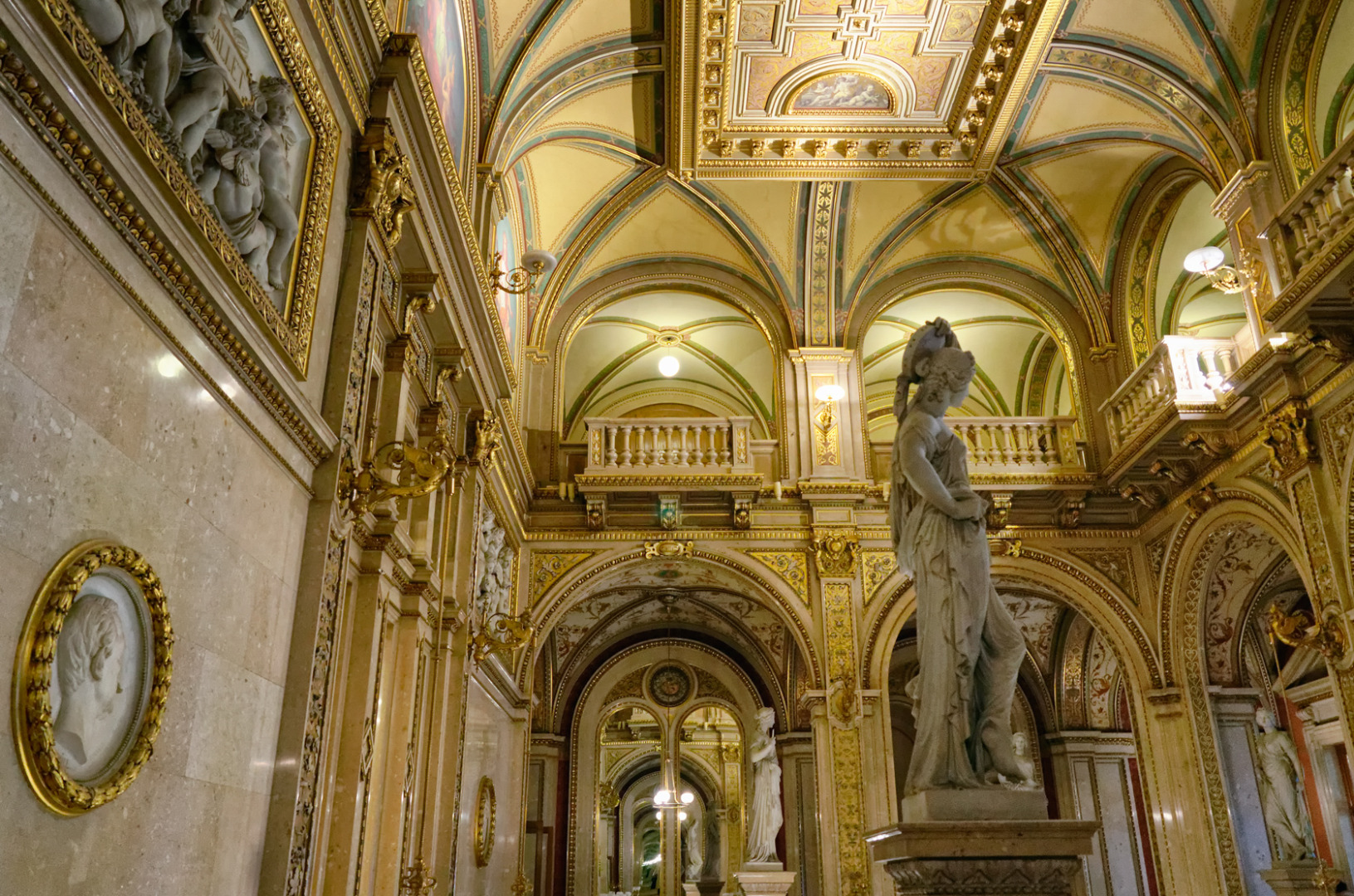 Statues on the Grand Staircase. f/4, 1/30, ISO 1600, 28mm
