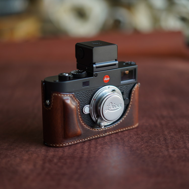 A more traditional distressed leather cuts the mustard for many Leica fans. This case is secured to the camera by means of a tripod screw and incorporates the bottom flap for instant access to the battery compartment. Note the Summaron, the sign of a true enthusiast!