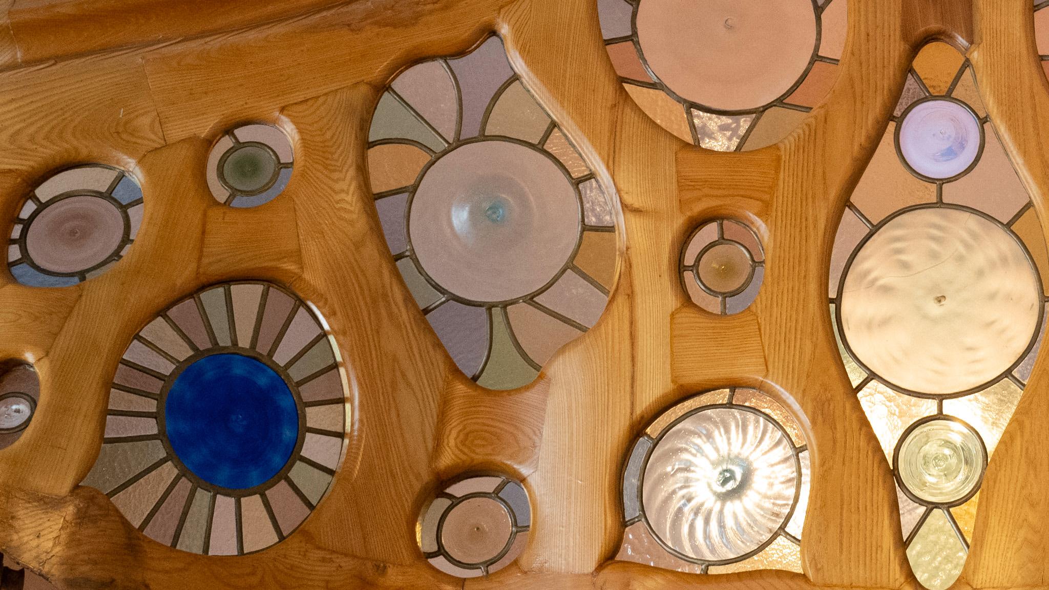 Stained glass discs embedded in a door frame, Casa Batllo