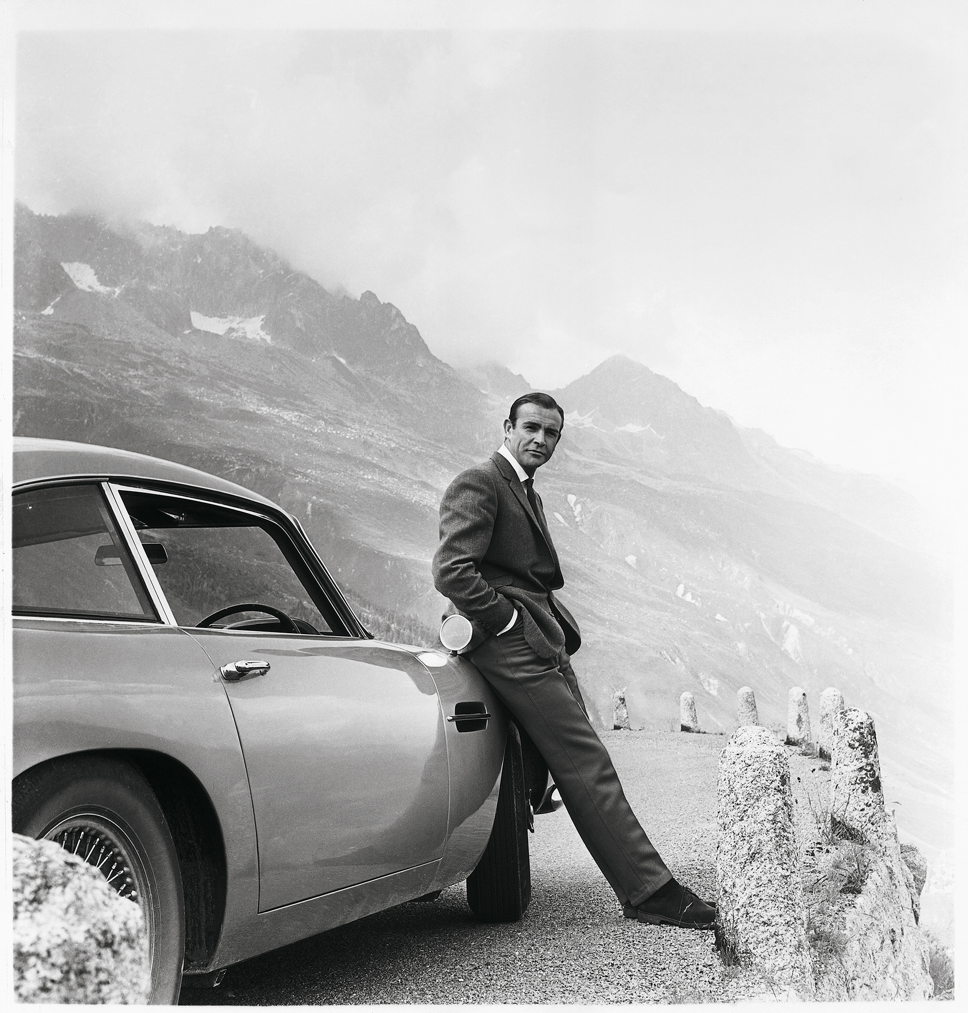 Goldfinger (1964)
James Bond (Sean Connery) and his iconic Aston Martin DB5 which first appeared on screen
in Goldfinger. On Thursday 17 September 1964, Goldfinger had its world premiere in London's Leicester Square.
Photograph by Bert Cann
GOLDFINGER © 1964 Danjaq, LLC and Metro- Goldwyn-Mayer Studios Inc. All Rights Reserved.