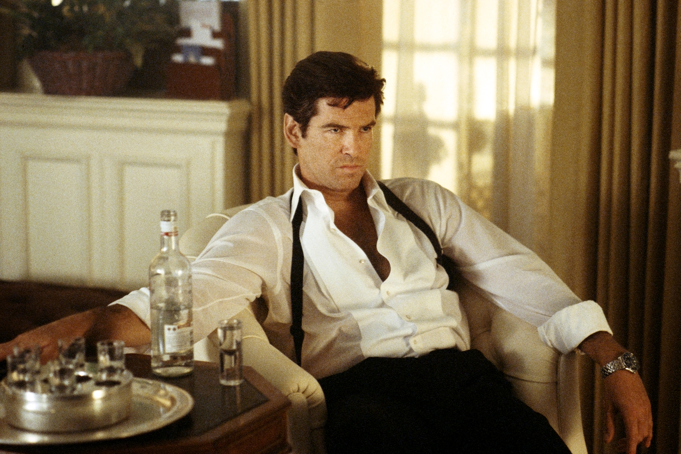 Tomorrow Never Dies (1997)
Bond (Pierce Brosnan) waits for Carver to send
a hit man; instead, he sends Paris. Photograph by Keith Hamshere
TOMORROW NEVER DIES © 1997 Danjaq, LLC and Eighteen Leasing Corporation. All Rights Reserved.