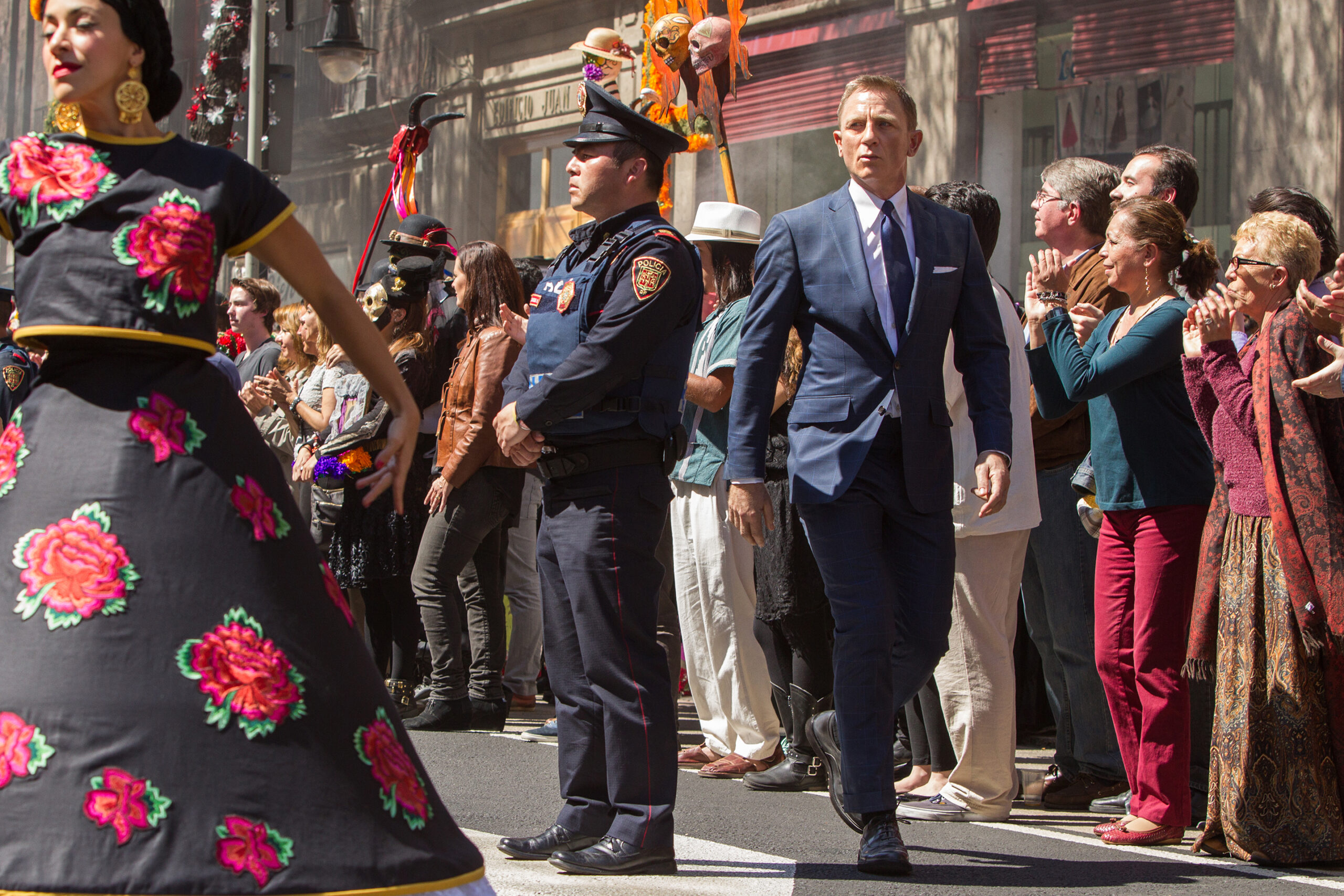 Spectre (2015)
Bond (Daniel Craig) following Marco Sciarra through the Dia de los Muertos procession; Tolsa Square, Mexico City.
Photograph by Stephen Vaughan
SPECTRE © 2015 Danjaq, LLC, Metro-Goldwyn- Mayer Studios Inc. and Columbia Pictures Industries, Inc. All Rights Reserved.
