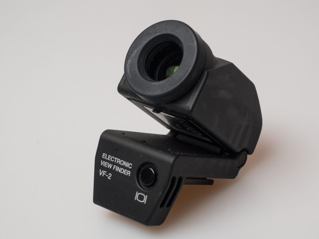 Product image shows one of the attachable viewfinders made by Olympus