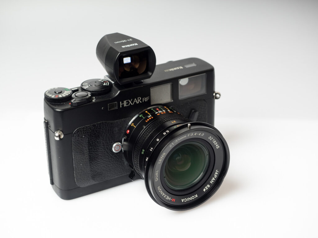 Product image shows one of the attachable viewfinders made by Konica mounted on a Konica Hexar RF analoge rangefinder camera