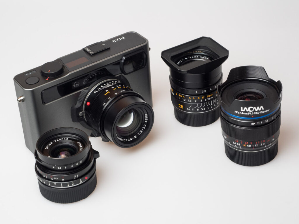 Product image shows the Pixii rangefinder camera with a Leica 50mm lens attached and more lenses from Leica, Voigtländer and Laowa.