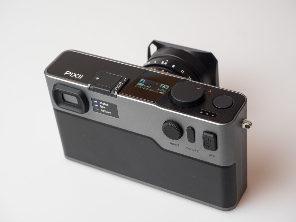 Product image shows the Pixii rangefinder camera with a Leica 28mm lens attached
