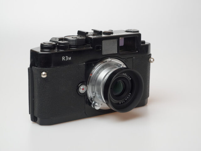 OLYMPUS DIGITAL CAMERA Product image shows Voigtländer Bessa R3M rangefinder camera with Voigtländer Heliar 40/2.8 lens.