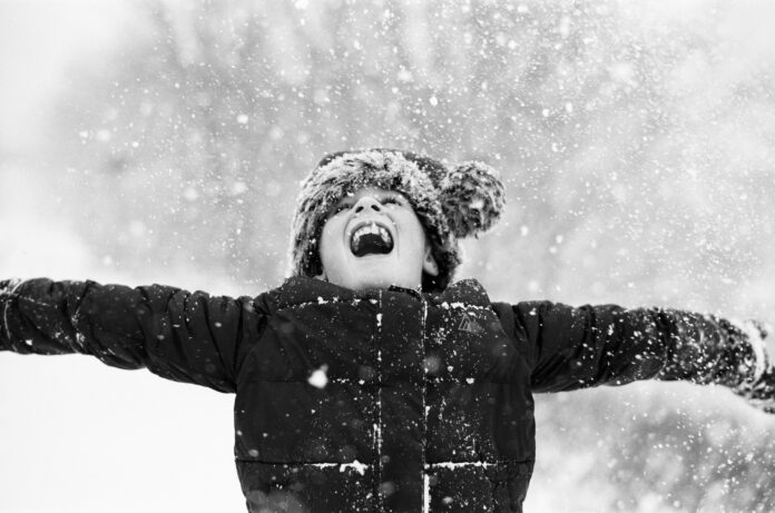 Girl laughing in snow