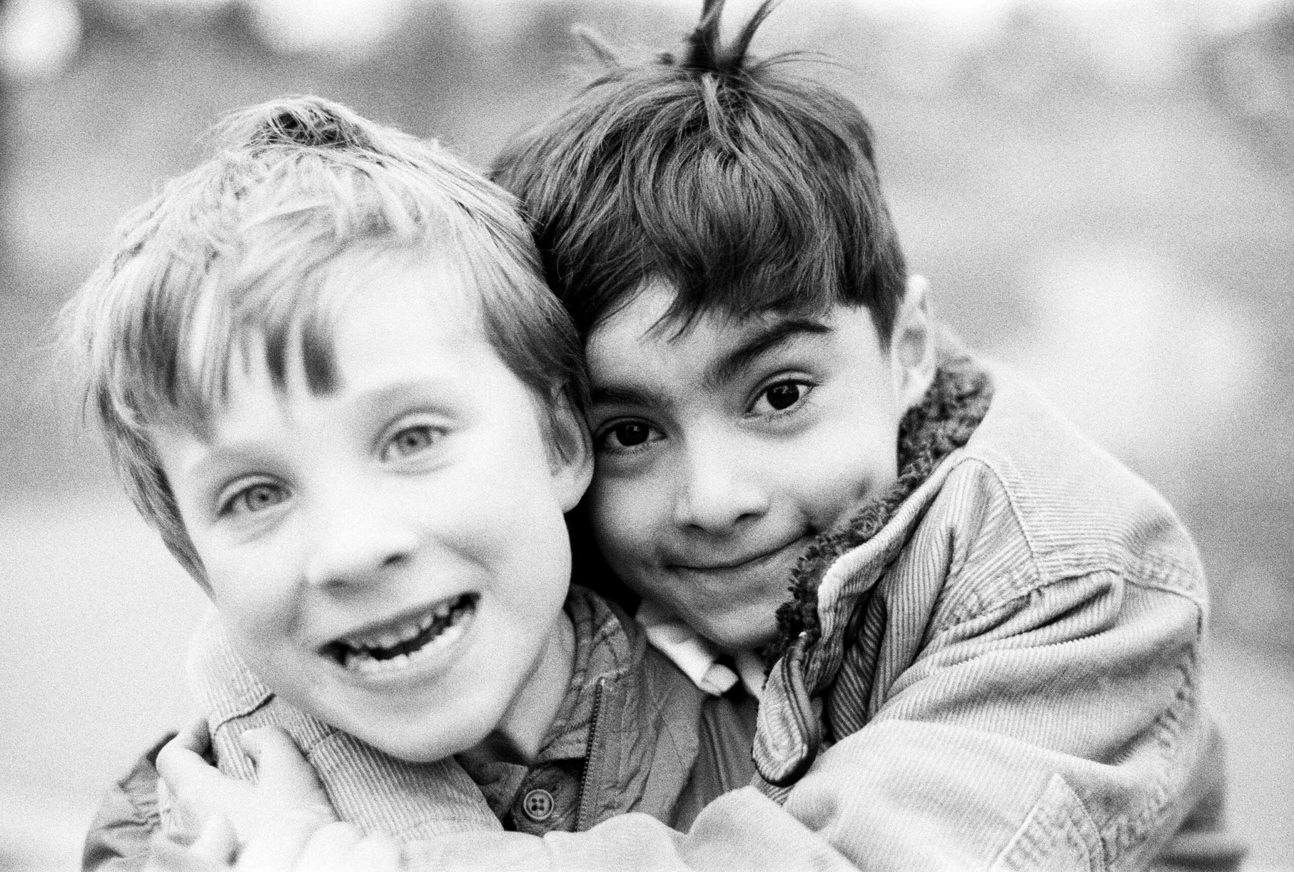 Two boys hugging