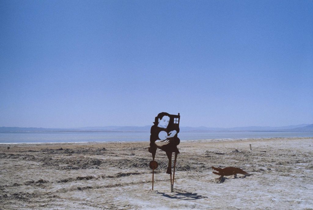 Image of two art installations on the shore of the Salton Sea at Bombay Beach, California