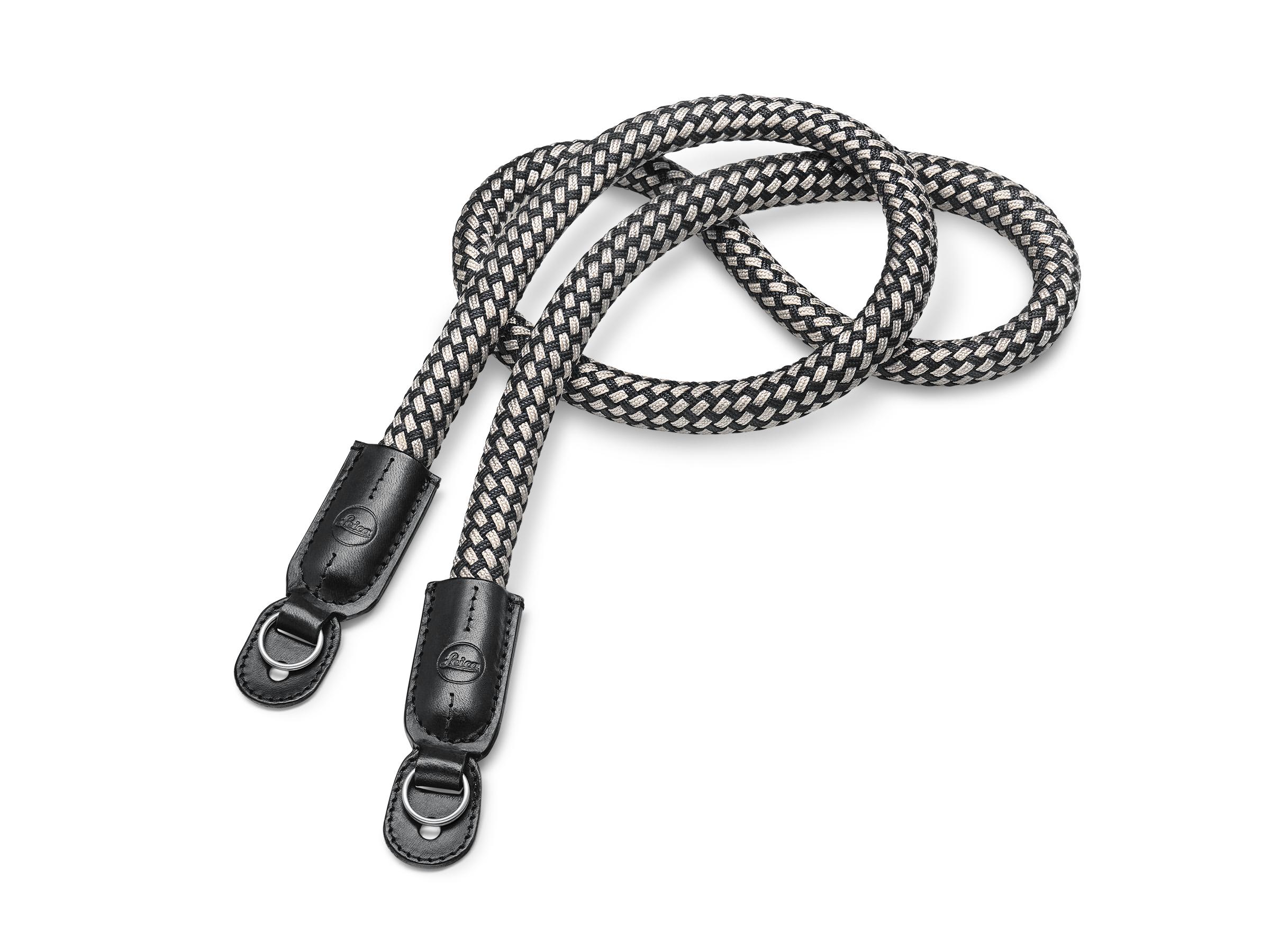 A braided grey and black carrying strap with leather ends designed for camera use.